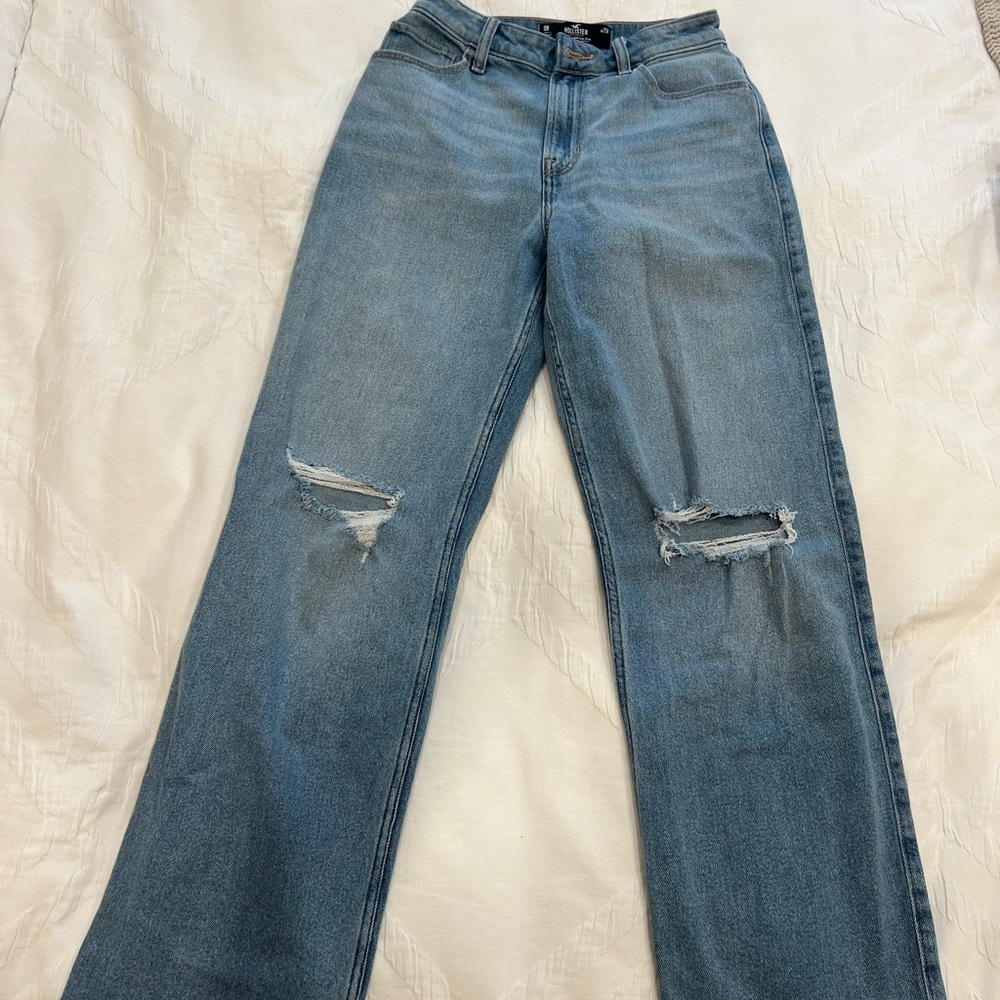 Ripped baggy blue jeans